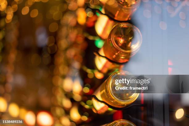 view through a restaurant window with defocused background and bottles of restaurant, bar, winery or cafeteria. - terrasse bar stock-fotos und bilder