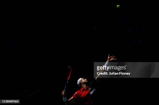John Isner of USA serves to Kyle Edmund of Great Britain during the Miami Open tennis on March 26, 2019 in Miami Gardens, Florida.