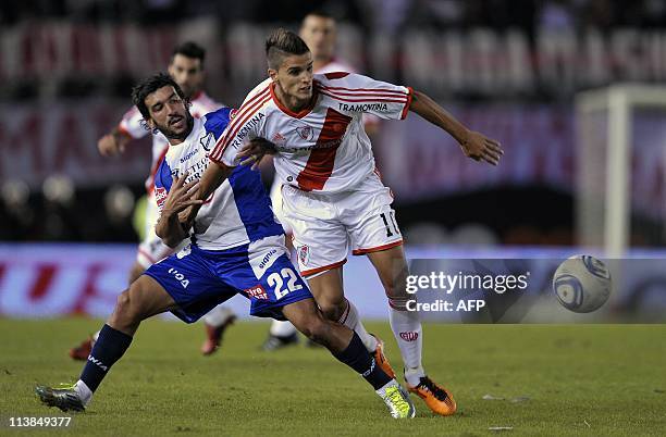 River Plate's midfielder Erik Lamela vies for the ball with All Boys' midfielder Juan Rodriguez, during Argentina's First Division football match, at...