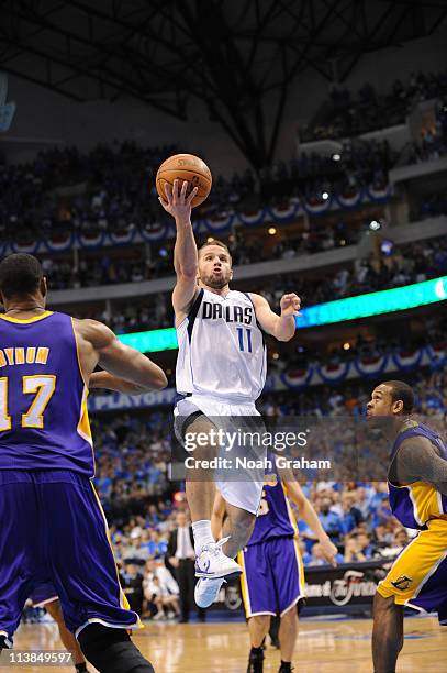 Jose Barea of the Dallas Mavericks shoots against Andrew Bynum of the Los Angeles Lakers during game Four of the Western Conference Semifinals in the...