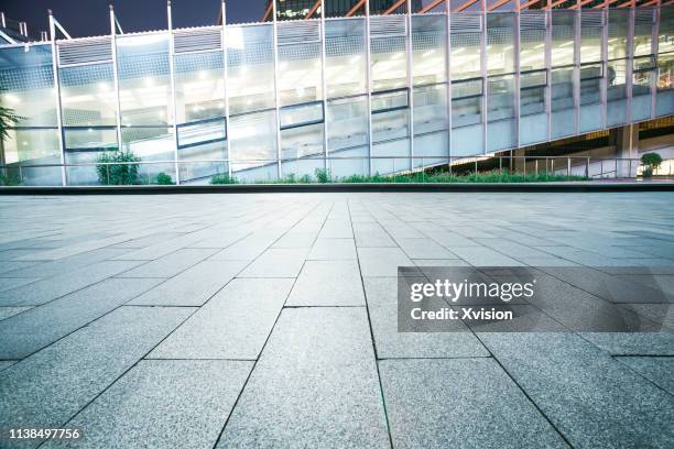 marble platform wideopen with elevator light modern building in the background for automobile commercial purpose - solid ground stock pictures, royalty-free photos & images