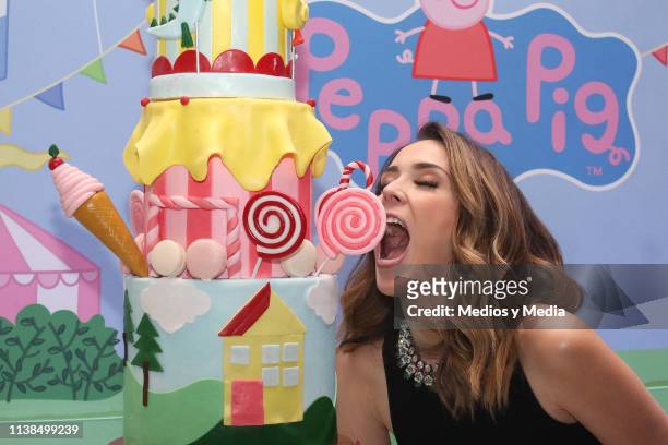 Jacqueline Bracamontes poses for photos with a Peppa Pig cake during the Press Conference of Discovery Kids TV Show 'Family Suite' at Hotel St. Regis...
