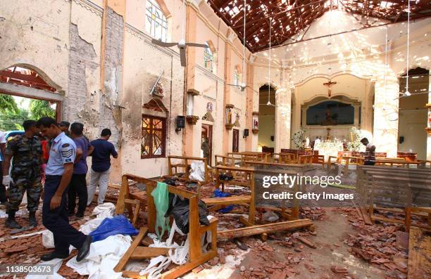 Sri Lankan officials inspect St. Sebastian's Church in Negombo, north of Colombo, after multiple explosions targeting churches and hotels across Sri...