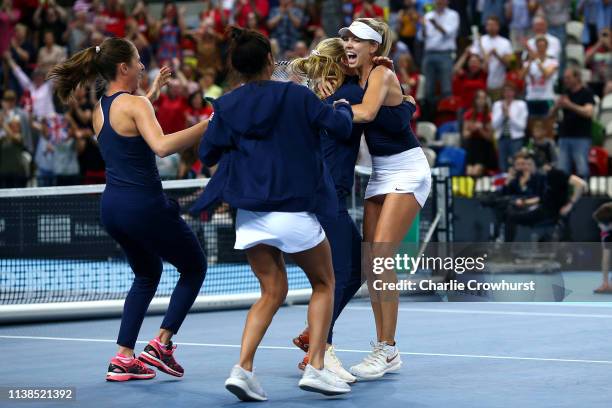 Katie Boulter of Great Britain celebrates with team mates Harriet Dart, Katie Swan, Johanna Konta, Heather Watson after winning her second singles...