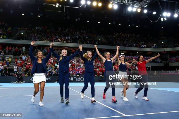 Heather Watson, Harriet Dart, Katie Swan, Johanna Konta, Katie Boulter and Captain Anne Keothavong celebrates the teams win and qualification during...