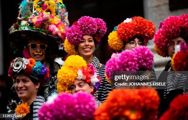People wear decorated hats during the annual NYC Easter Parade and Bonnet Festival on 5th Avenue in Manhattan on April 21, 2019 in New York City.