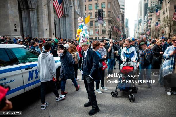 Man wears a decorated hat during the annual NYC Easter Parade and Bonnet Festival on 5th Avenue in Manhattan on April 21, 2019 in New York City.