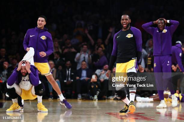 LeBron James and the Los Angeles Lakers bench react after a play by Lance Stephenson against the Washington Wizards during the first half at Staples...