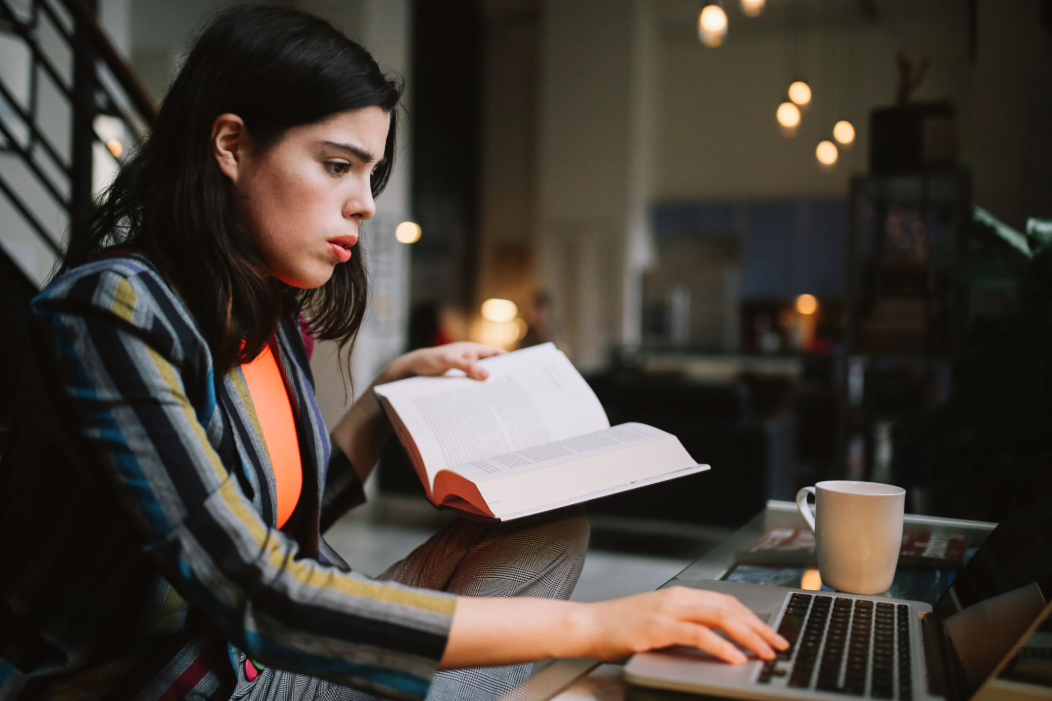 young woman doing her studies in Downtown Los Angeles apartment young woman doing her studies in Downtown Los Angeles apartment