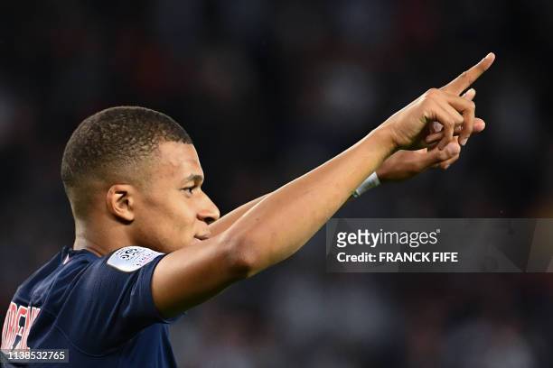 Paris Saint-Germain's French forward Kylian Mbappe celebrates after scoring his team second goal during the French L1 football match between Paris...