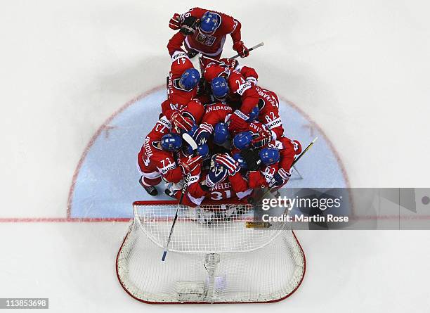 The team of Czech Republic celebrate after the IIHF World Championship qualification match between Czech Republic and Russia at Orange Arena on May...