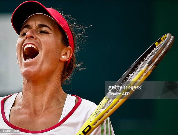 Anabel Medina Garrigues from Spain celebrates after winning her final match against Kristina Barrois from Germany during the Estoril Open tennis...