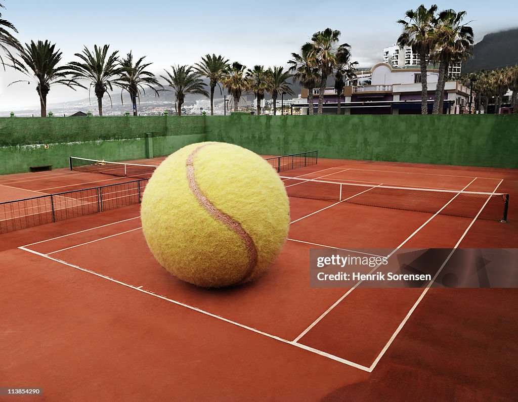 Oversized ball on an outdoor tennis court