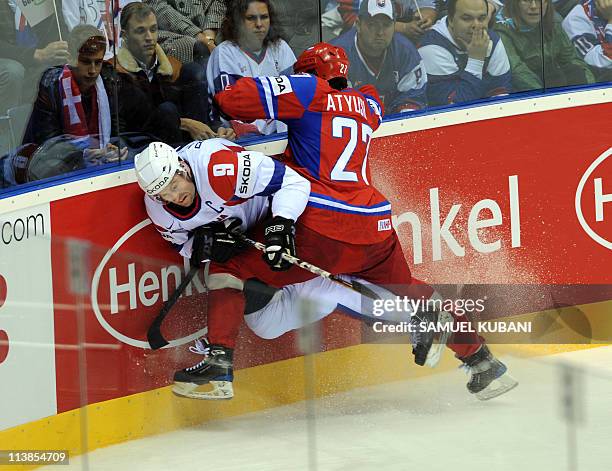 Slovenia's Tomaz Razingar and Russia's Vitali Atyushov fight during the IIHF Ice Hockey World Championship group A match in Bratislava on May 1,...