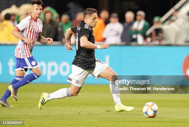 Javier Hernandez of the Mexico National team dribbles the ball up field against Paraguay during the second half of their soccer game at Levi's...