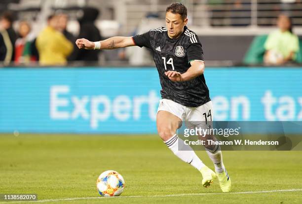 Javier Hernandez of the Mexico National team dribbles the ball up field against Paraguay during the second half of their soccer game at Levi's...