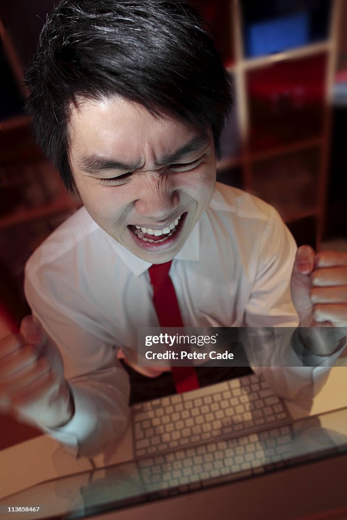 Male executive furious at computer