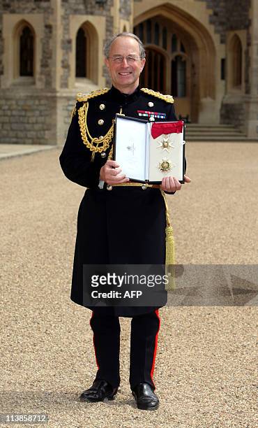 General Sir David Richards poses for photographers after receiving his Knight Grand Cross of the Order of the Bath from Britain's Queen Elizabeth II...