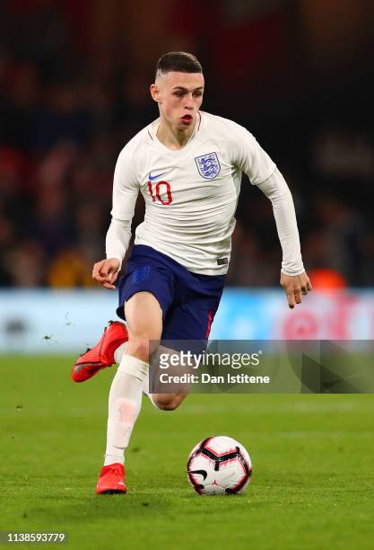 Phil Foden of England runs with the ball during the International Friendly match between England U21 and Germany U21 at Vitality Stadium on March 26,...