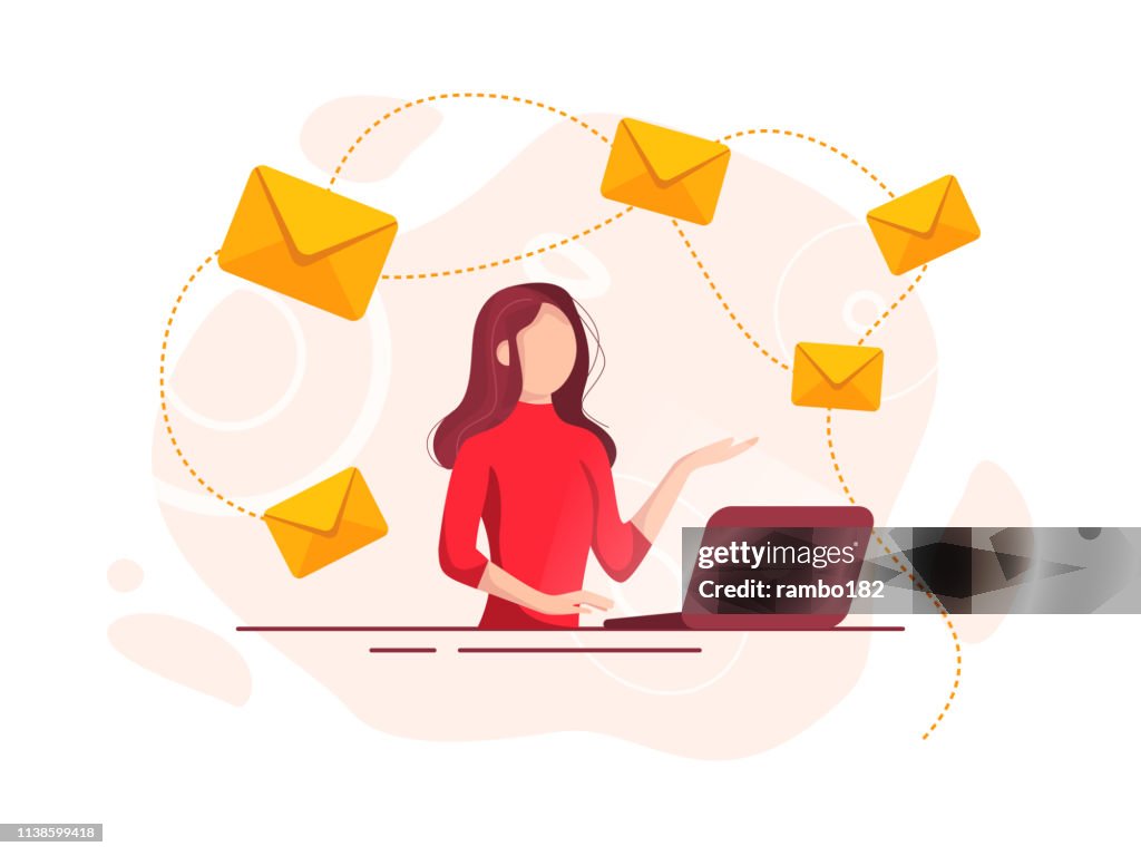 Beautiful cheerful young businesswoman working on laptop. E-mail and communication concept.