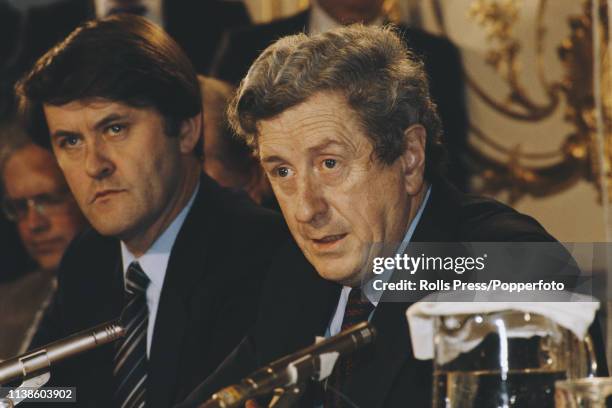 Taoiseach of Ireland Garret Fitzgerald pictured seated on right with deputy leader Michael O'Leary as they address a joint press conference at the...