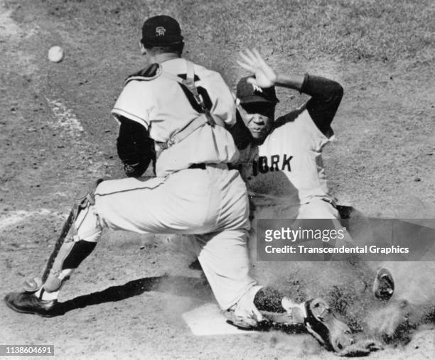 In game two of the World Series, San Francisco Giants' catcher Ed Bailey and New York Yankees player Elston Howard collide at home plate, San...