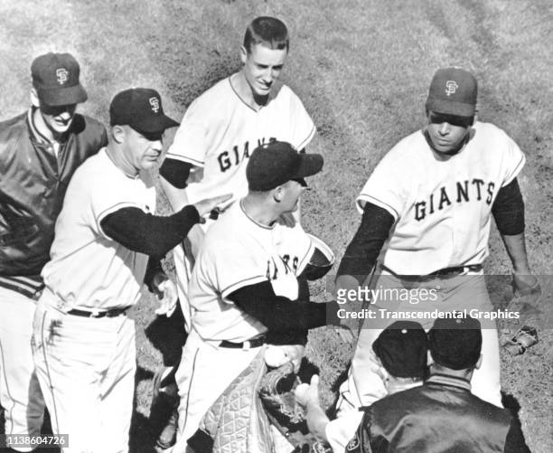 As they leave the field in Candlestick Park, baseball players Billy Pierce shakes hands with teammate Orlando Cepeda after a winning game, San...