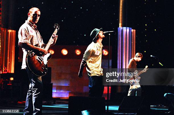 Paul "Bonehead" Arthurs, Noel Gallagher and Liam Gallagher of Oasis