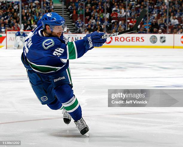 Jannik Hansen of the Vancouver Canucks takes a slap shot in Game Five of the Western Conference Semifinal against the Nashville Predators in the 2011...
