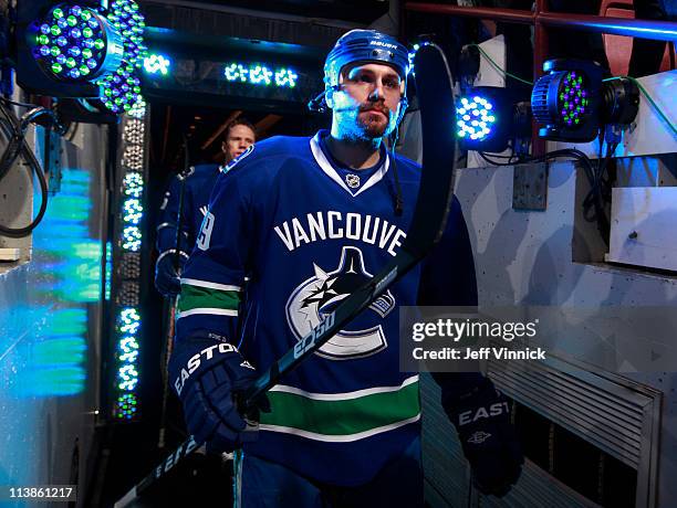 Aaron Rome of the Vancouver Canucks walks out to the ice in Game Five of the Western Conference Semifinal against the Nashville Predators in the 2011...