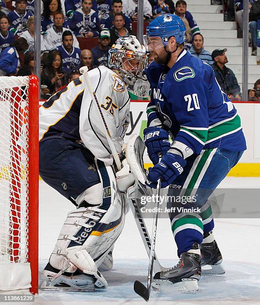 Chris Higgins of the Vancouver Canucks skates into the crease of Pekka Rinne of the Nashville Predators in Game Five of the Western Conference...