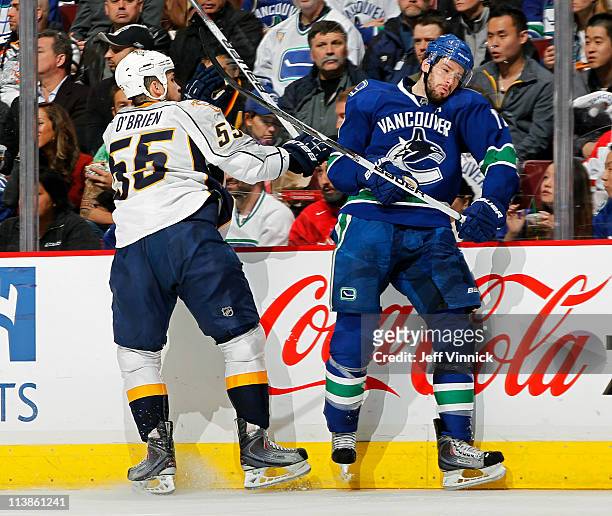 Shane O'Brien of the Nashville Predators checks Ryan Kesler of the Vancouver Canucks in Game Five of the Western Conference Semifinal during the 2011...