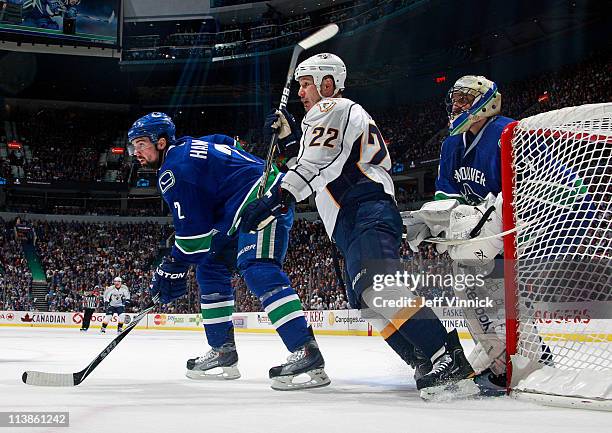 Dan Hamhuis of the Vancouver Canucks and Jordin Tootoo of the Nashville Predators stand in front of Roberto Luongo of the Vancouver Canucks in Game...