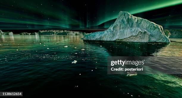 iceberg floating in greenland fjord at night with green northern lights - iceberg imagens e fotografias de stock