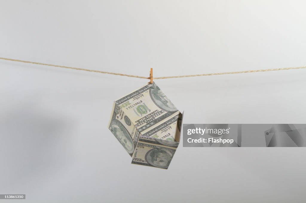 US dollar house pegged and hanging on line