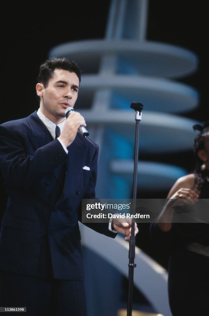 Mark Reilly, singer with British pop group, Matt Bianco, singing into ...
