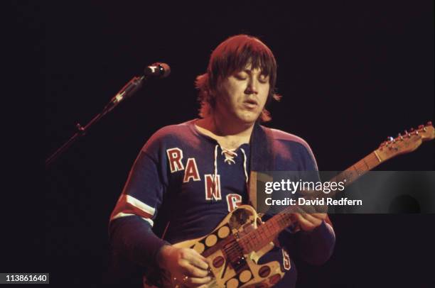 Terry Kath , guitarist with U.S. Rock band Chicago, playing the guitar during a live concert performance at the Hammersmith Odeon in London, England,...