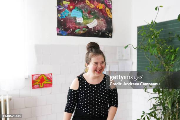 a ballet dancer with down syndrome is smiling. - disabilitycollection ストックフォトと画像