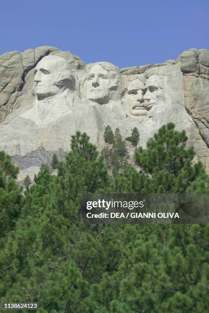 The faces of American Presidents George Washington, Thomas Jefferson, Theodore Roosevelt and Abraham Lincoln carved in the granite, Mount Rushmore...