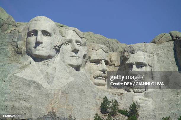 The faces of American Presidents George Washington, Thomas Jefferson, Theodore Roosevelt and Abraham Lincoln carved in the granite, Mount Rushmore...