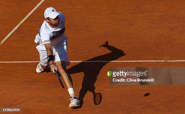 Mardy Fish of the USA plays a forehand volley during his first round match against Santiago Giraldo of Columbia during day two of the Internazoinali...