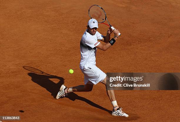 Mardy Fish of the USA plays a backhand during his first round match against Santiago Giraldo of Columbia during day two of the Internazoinali BNL...