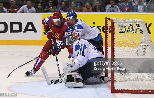 Danis Zaripov of Russia fails to score over Teemu Lassila , goaltender of Finland during the IIHF World Championship qualification match between...