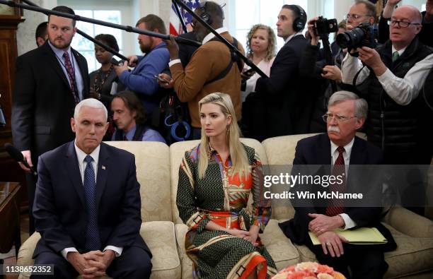 Vice President Mike Pence, Ivanka Trump and National Security Advisor John Bolton listen as U.S. President Donald Trump meets with Fabiana Rosales,...