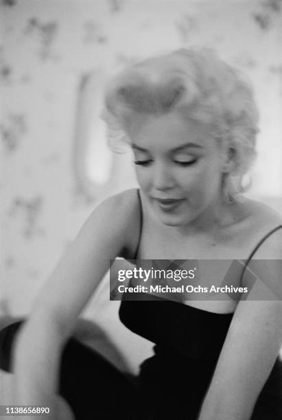 American actress Marilyn Monroe in her room at the Ambassador Hotel, New York City, US, 24th March 1955. She is getting ready to attend a performance...