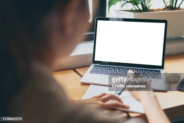 woman hands working with blank screen laptop computer mock up.hands at work with digital technology.working on desk environment.planing and working with mobile device screen template. - laptop imagens e fotografias de stock