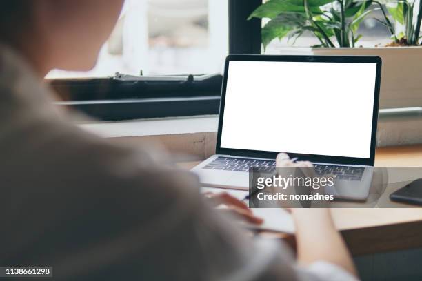 woman hands working with blank screen laptop computer mock up.hands at work with digital technology.working on desk environment.planing and working with mobile device screen template. - pen mockup stock pictures, royalty-free photos & images