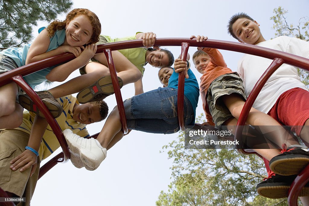 Children climbing on monkey bars at a playground