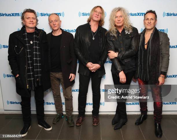 Musicians Rick Allen, Phil Collen, Joe Elliot, Rick Savage and Vivian Campbell of Def Leppard visits the SiriusXM Studios on March 27, 2019 in New...