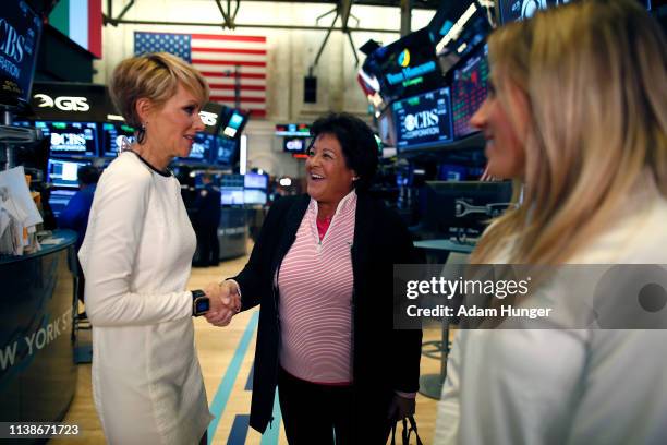 Gerri Willis shakes hands with Nancy Lopez at the New York Stock Exchange for the Augusta National Women's Amateur press tour on March 27, 2019 in...